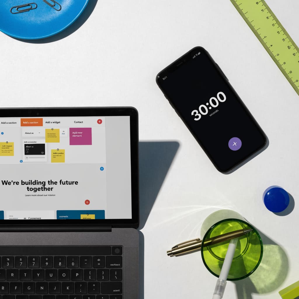 Laptop and phone timer showing a website built in 30 minutes